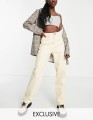KREMOWE JEANSY KIESZENIE (W40)