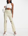 zemeta-high-rise-cut-out-flared-pants-in-cream-with-tie-waist (3).jpg