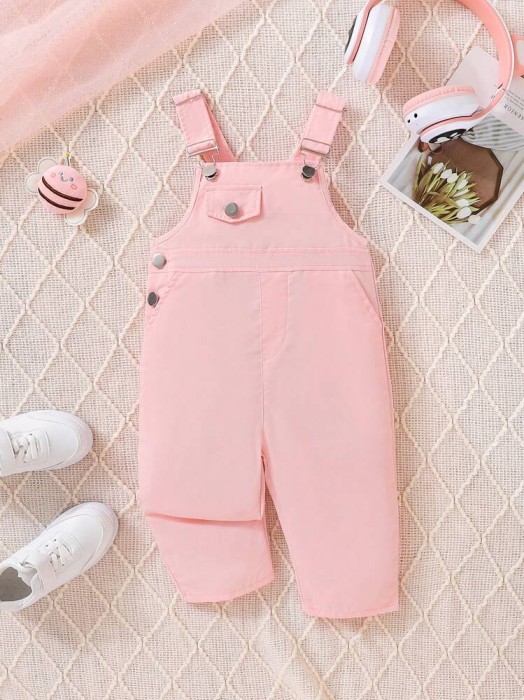 Jasnoróżowy kombinezon kieszenie (9-12M)