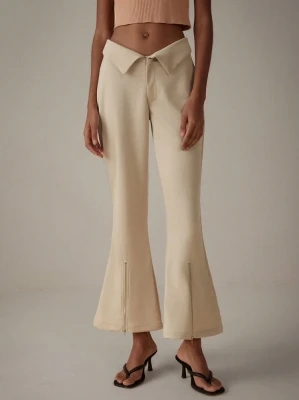 Beżowe spodnie dzwony zamki (S)