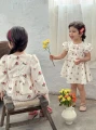 Sukienka ecru wzór kokardy (6-9M)