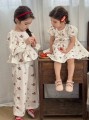 Sukienka ecru wzór kokardy (6-9M)