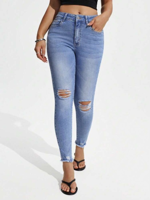 Niebieskie jeansy rurki dziury (M)