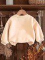 Beżowa bluza nadruk kwiaty (9-12L)