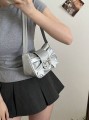 Srebrna metaliczna torebka kokarda