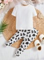 Biały komplet legginsy koszulka wzór (9-12M)