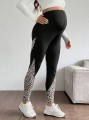 Czarne legginsy wzór zwierzęcy (S)