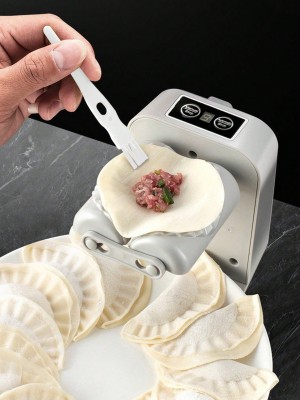 Szara maszynka do pierogów