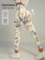 Śmietankowe legginsy tie dye (S)